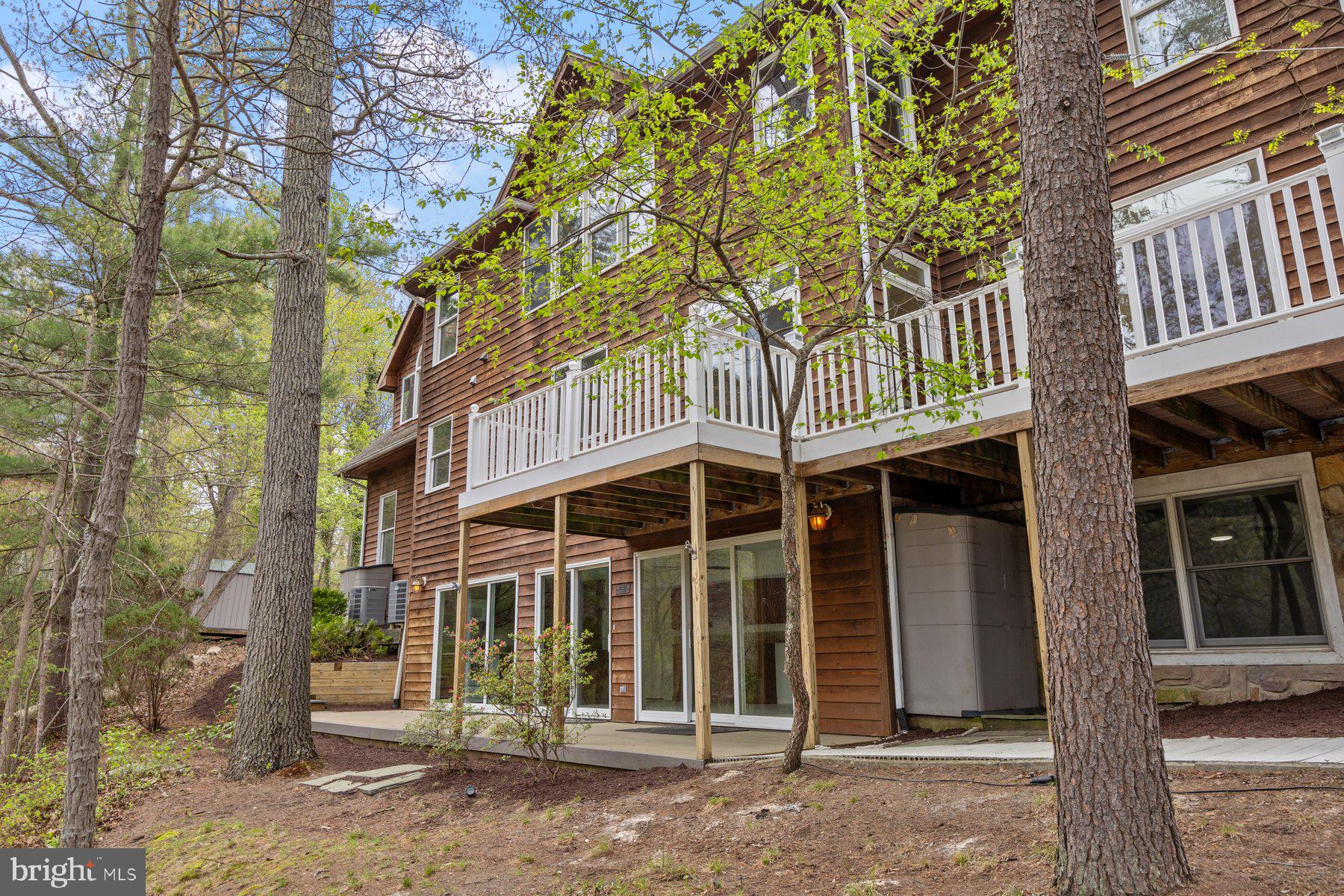 322 Piney Point Road Pasadena, MD 21122 - Photo 41 of 50 front view of a house with a tree