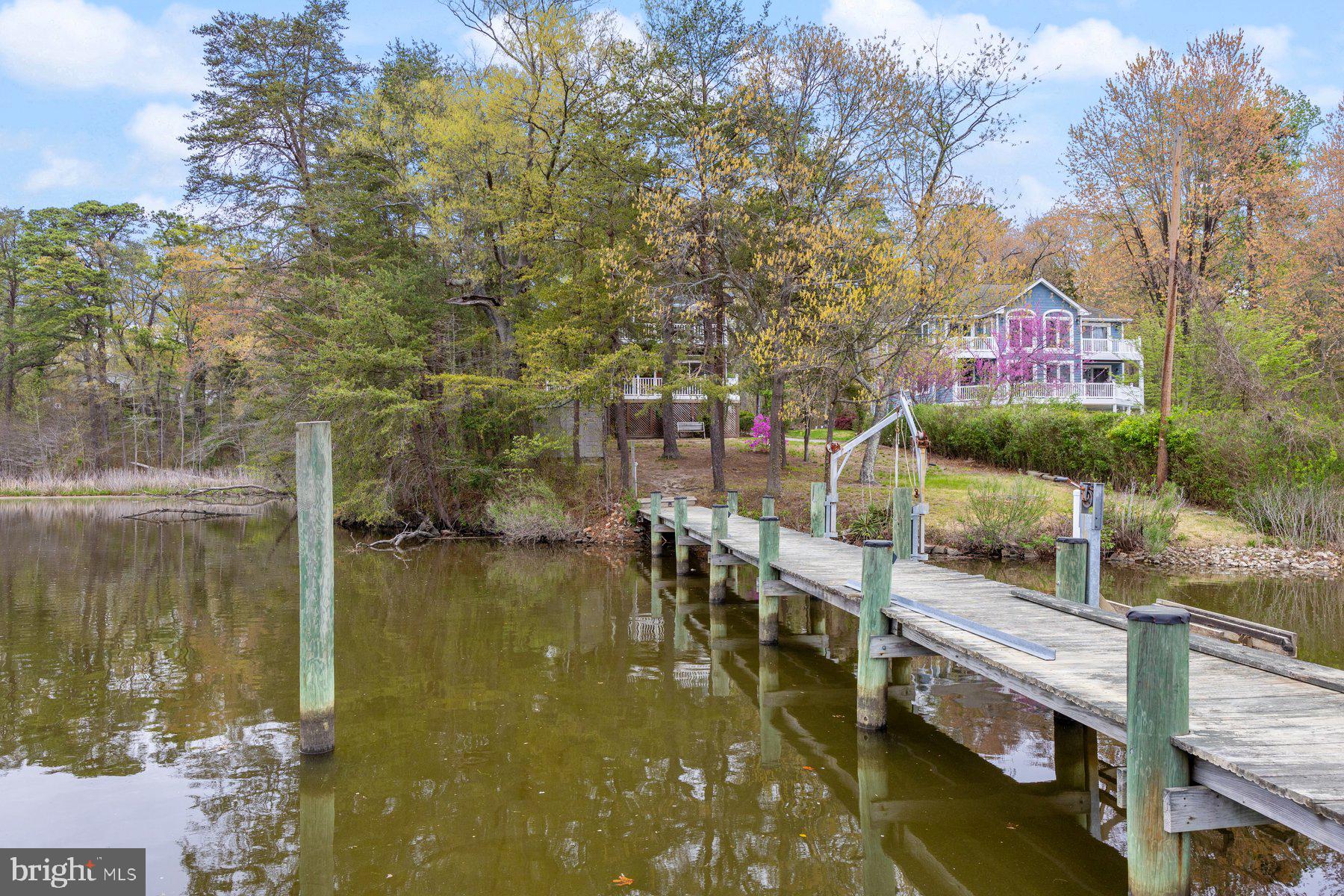 322 Piney Point Road Pasadena, MD 21122 - Photo 44 of 50 a view of water pond with outdoor seating