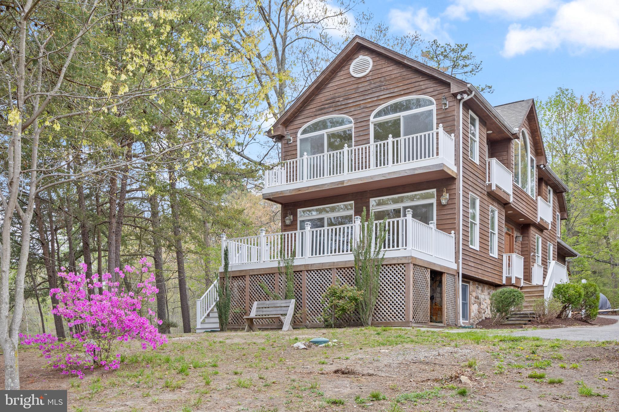 322 Piney Point Road Pasadena, MD 21122 - Photo 6 of 50 a front view of a house with a yard