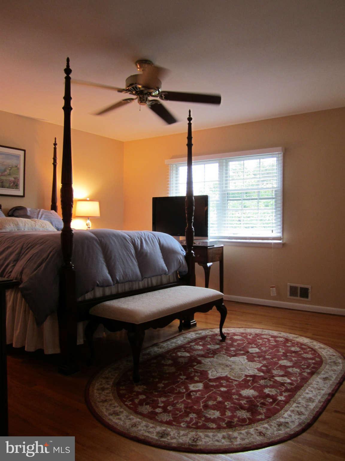 1113 Peachtree Road Fallston, MD 21047 - Photo 20 of 30 a living room with a couch and a chandelier