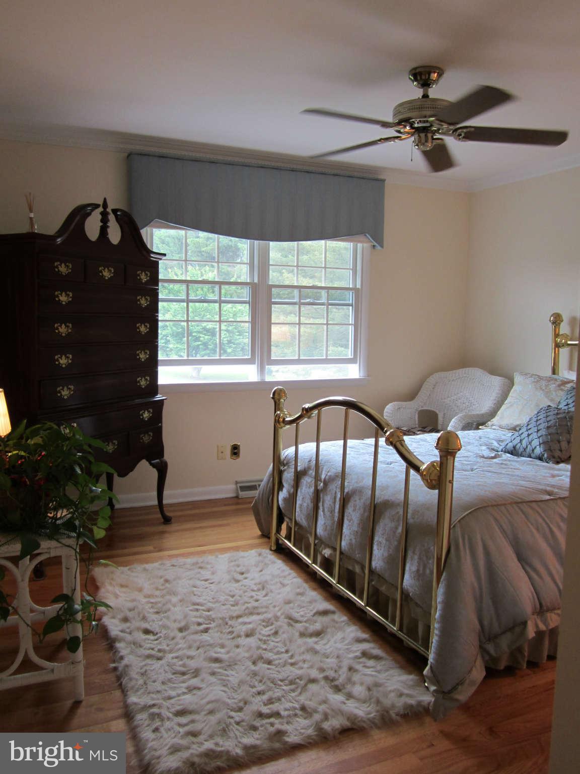 1113 Peachtree Road Fallston, MD 21047 - Photo 24 of 30 a bedroom with a bed and a ceiling fan