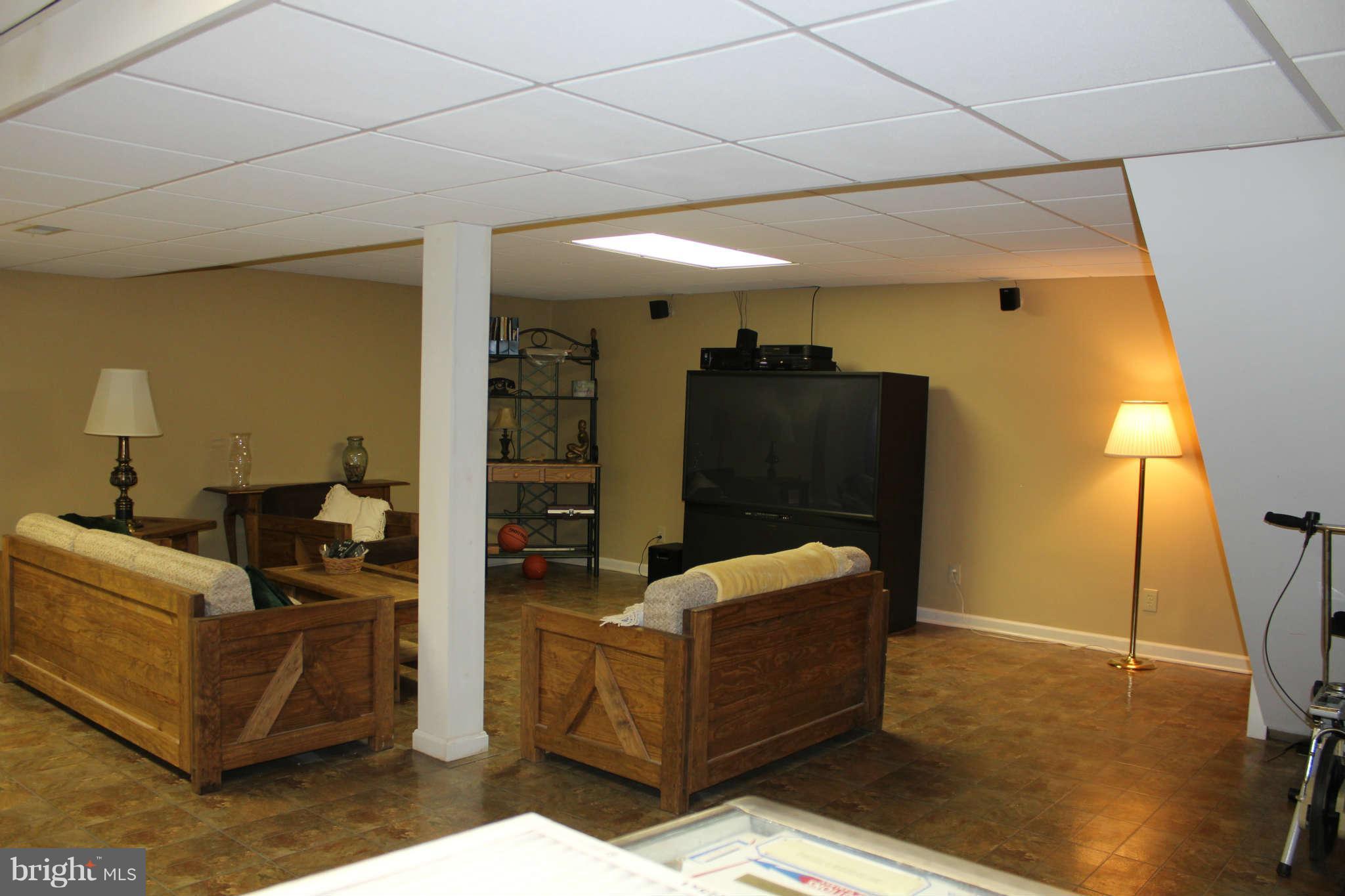 1113 Peachtree Road Fallston, MD 21047 - Photo 29 of 30 a living room with furniture and a flat screen tv