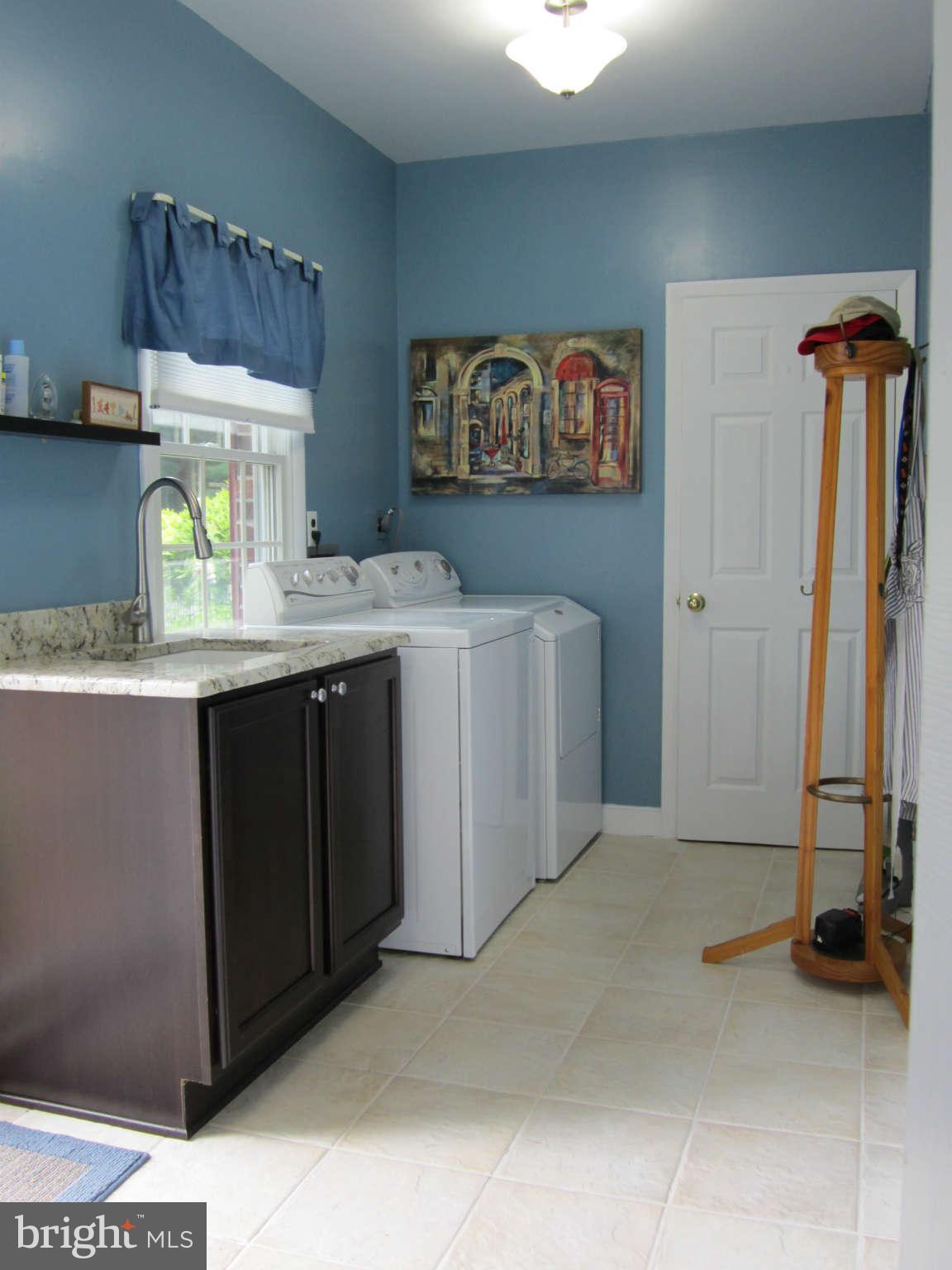 1113 Peachtree Road Fallston, MD 21047 - Photo 8 of 30 a utility room with a sink a washer and dryer