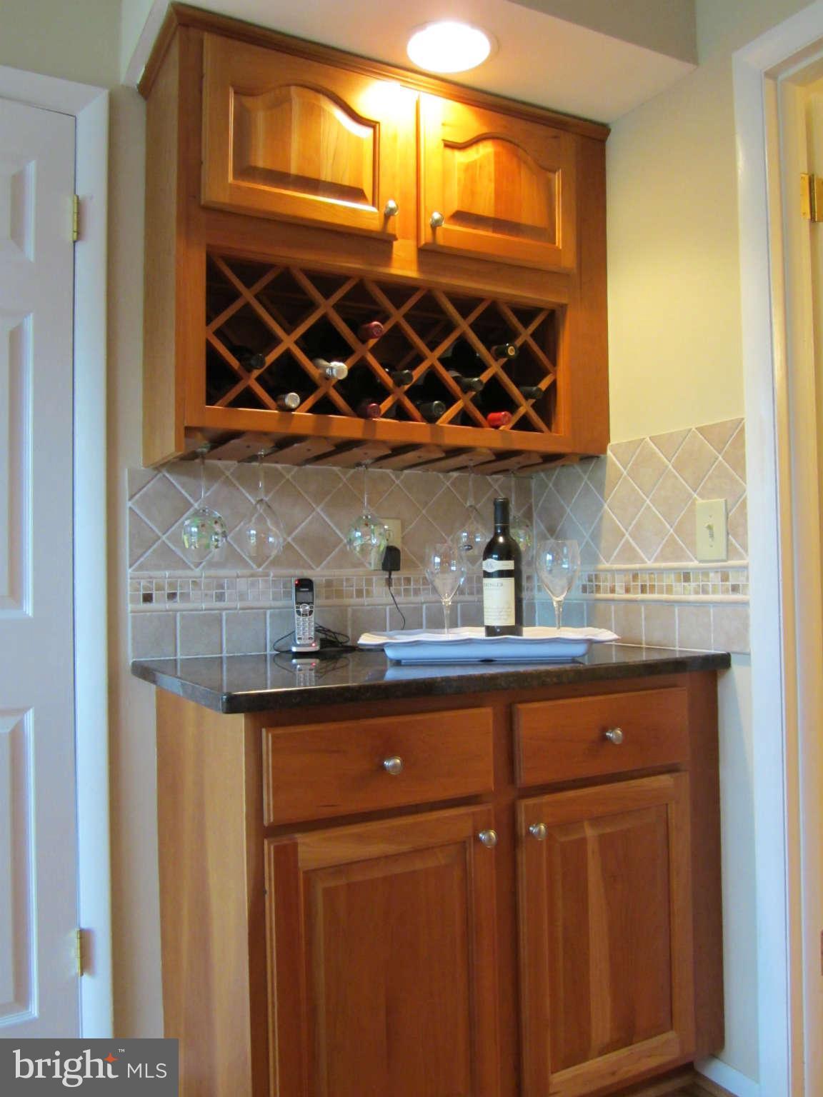 1113 Peachtree Road Fallston, MD 21047 - Photo 10 of 30 a kitchen with stainless steel appliances granite countertop a sink and wooden cabinets