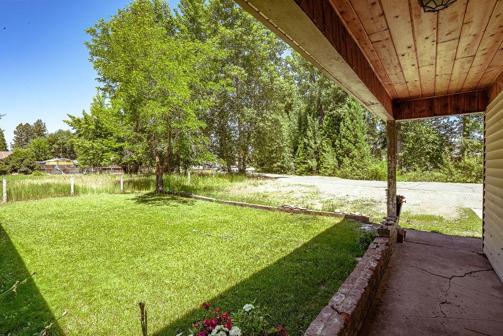 470 Riverside Avenue Chester, CA 96020 - Photo 23 of 25 a view of a yard with large trees