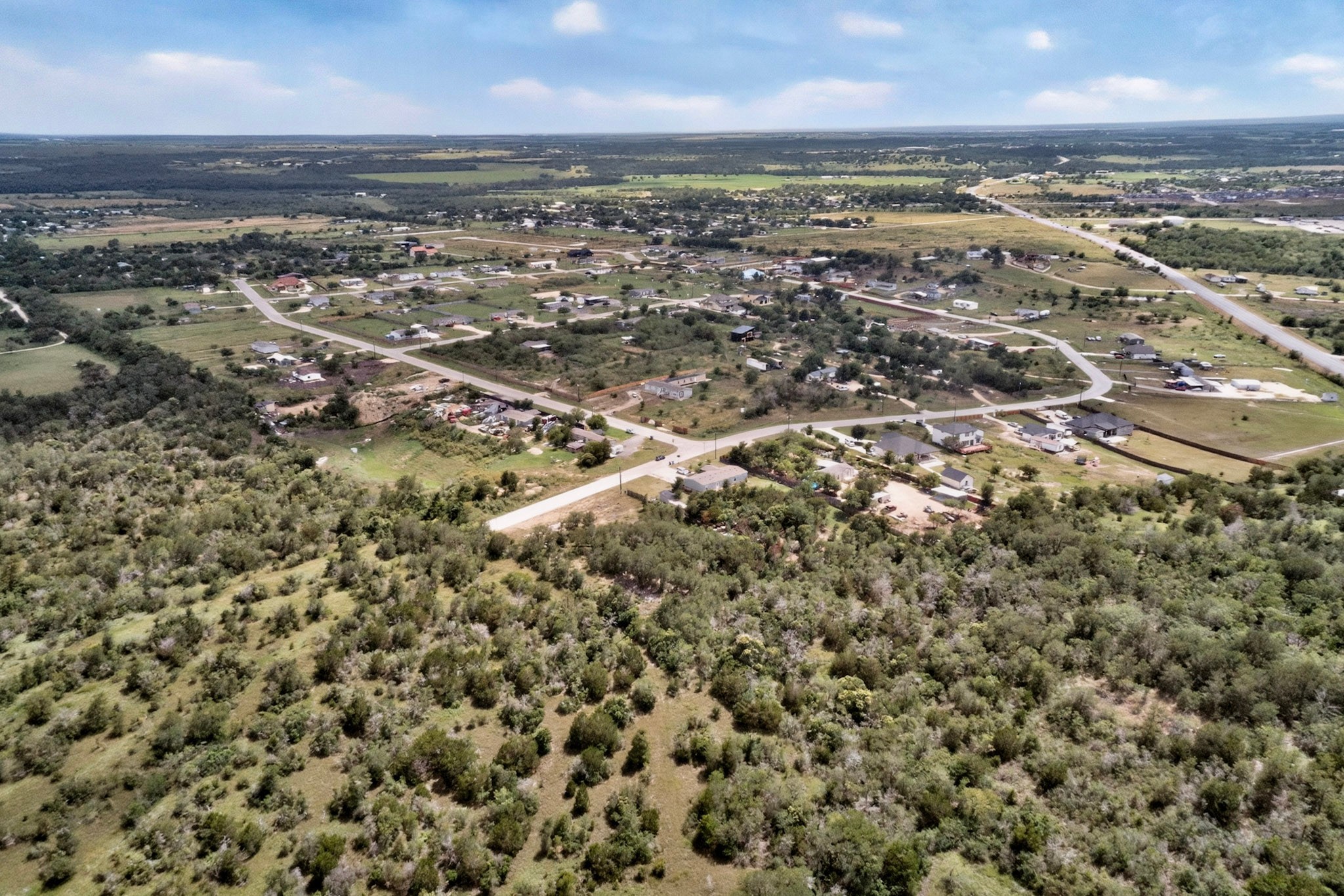 693 Santa Teresa Road Kyle, TX 78640 - Photo 2 of 20 Vast natural landscapes offering unparalleled views and expansion opportunities await in this sprawling neighborhood.