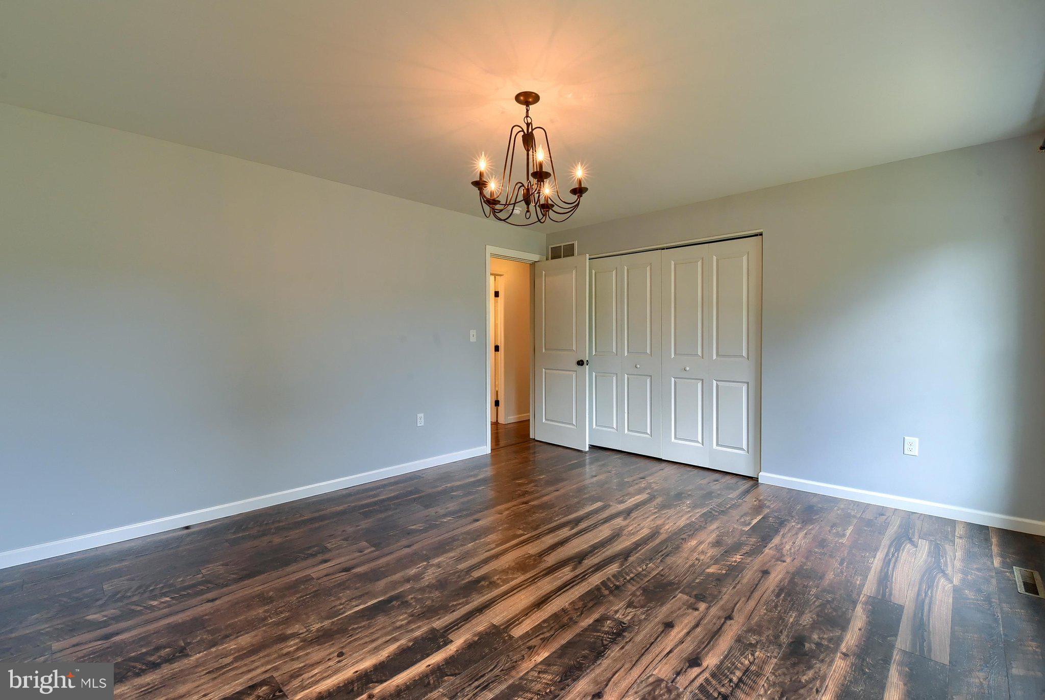 3740 Beagle Road Middletown, PA 17057 - Photo 14 of 70 a view of a room with wooden floor staircase and a window