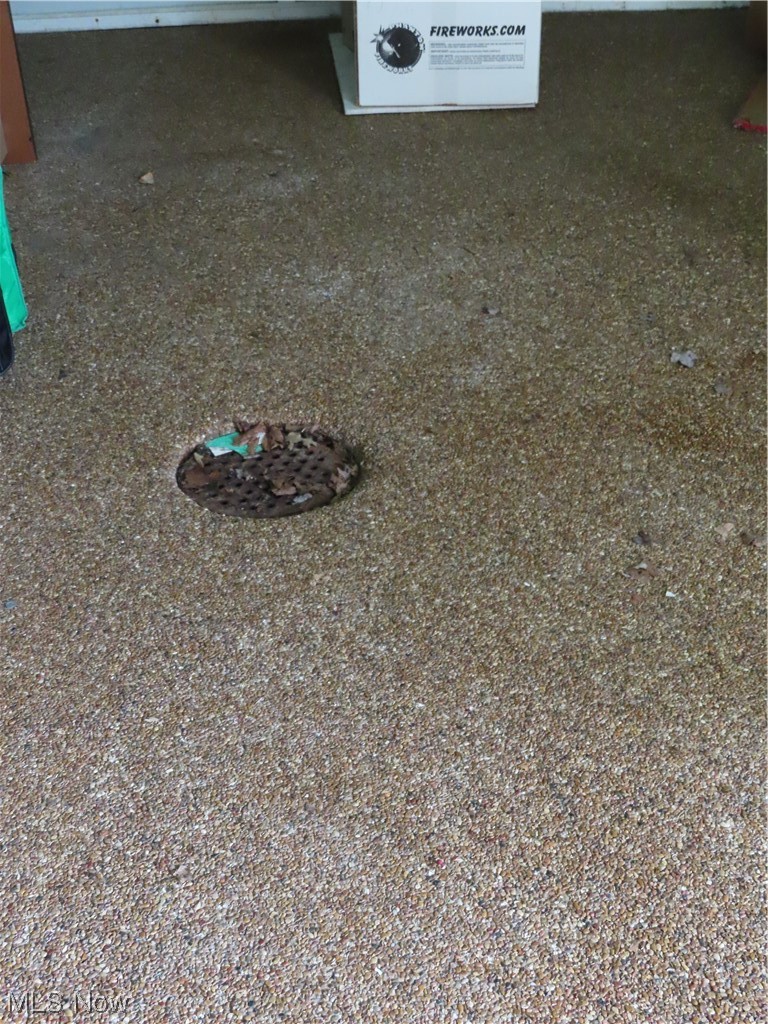 1520 Meadowlane Road Independence, OH 44131 - Photo 27 of 32 Nature stone and drain in the garage
