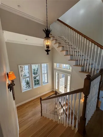a view of an entryway with wooden floor