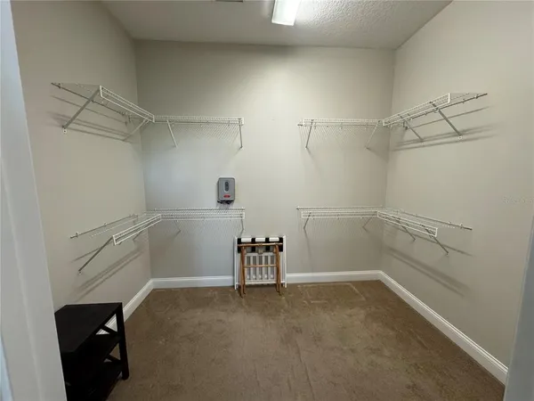 a view of a room with racks on the wall
