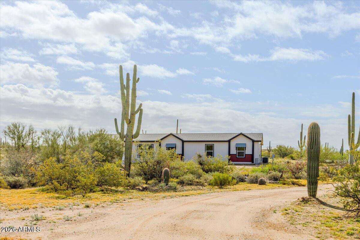 33597 South Davis Ranch Road Marana, AZ 85658 - Photo 1 of 48 a front view of a house with a yard
