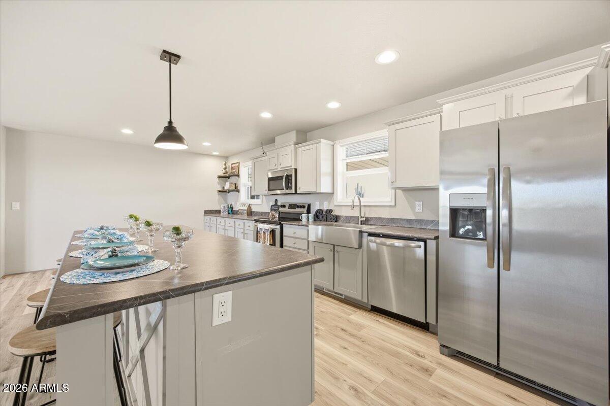 33597 South Davis Ranch Road Marana, AZ 85658 - Photo 13 of 48 a kitchen with refrigerator and window