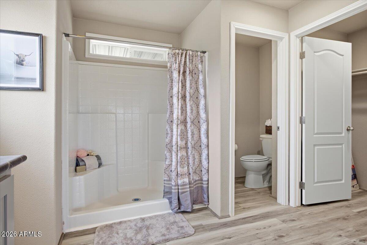 33597 South Davis Ranch Road Marana, AZ 85658 - Photo 21 of 48 a bathroom with a shower and a toilet