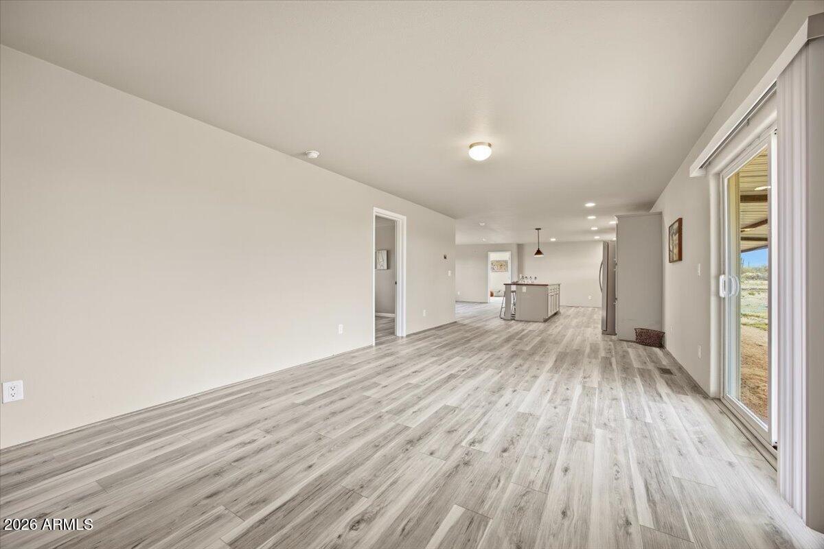 33597 South Davis Ranch Road Marana, AZ 85658 - Photo 24 of 48 a view of empty room with wooden floor