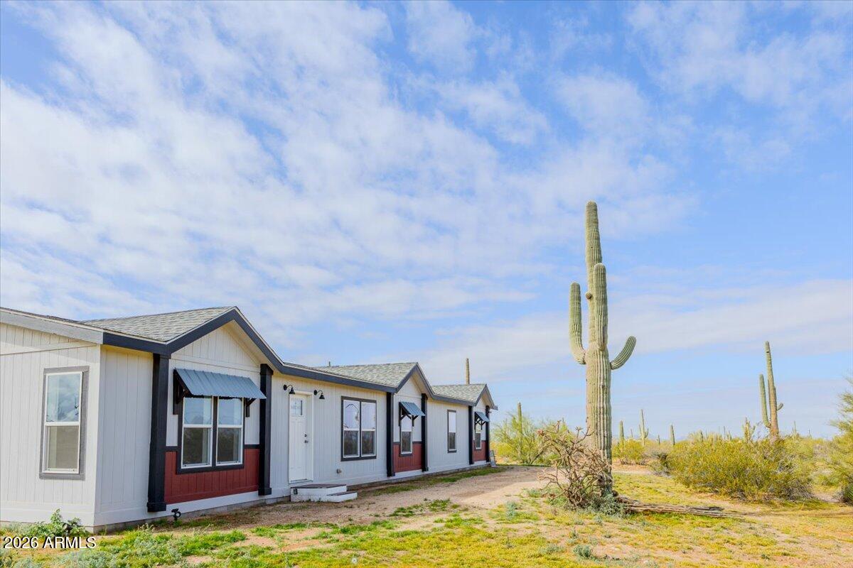 33597 South Davis Ranch Road Marana, AZ 85658 - Photo 5 of 48 a front view of a house with a yard