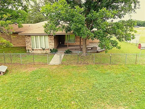 a view of a house with pool and a big yard