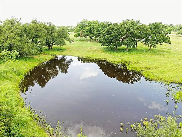 a view of a lake with a yard