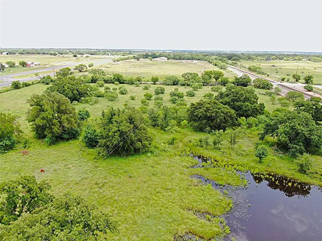 a view of a field with an ocean