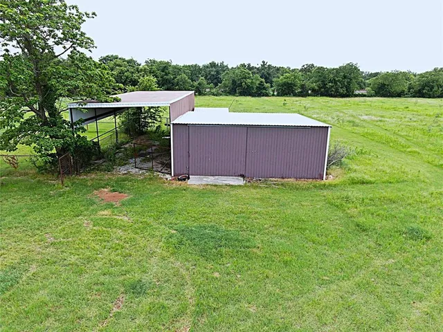a backyard of a house with lots of green space