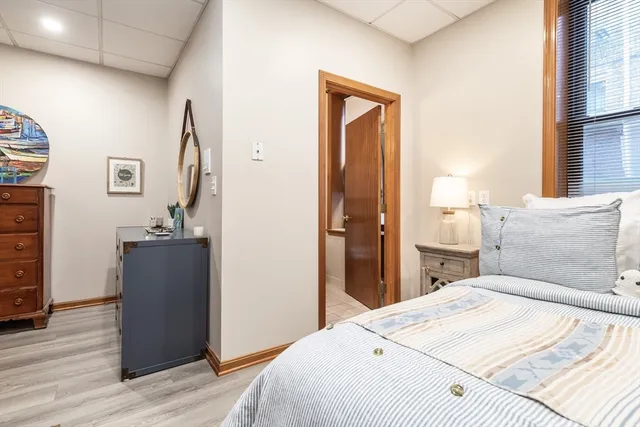 a bedroom with a bed and a dresser