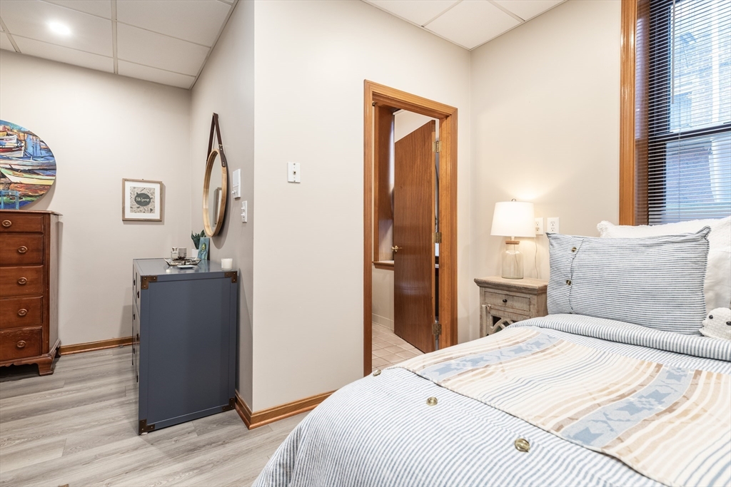 265 North Street, Unit A Boston, MA 02113 - Photo 12 of 17 a bedroom with a bed and a dresser