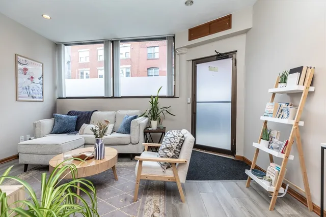 a living room with furniture and a window