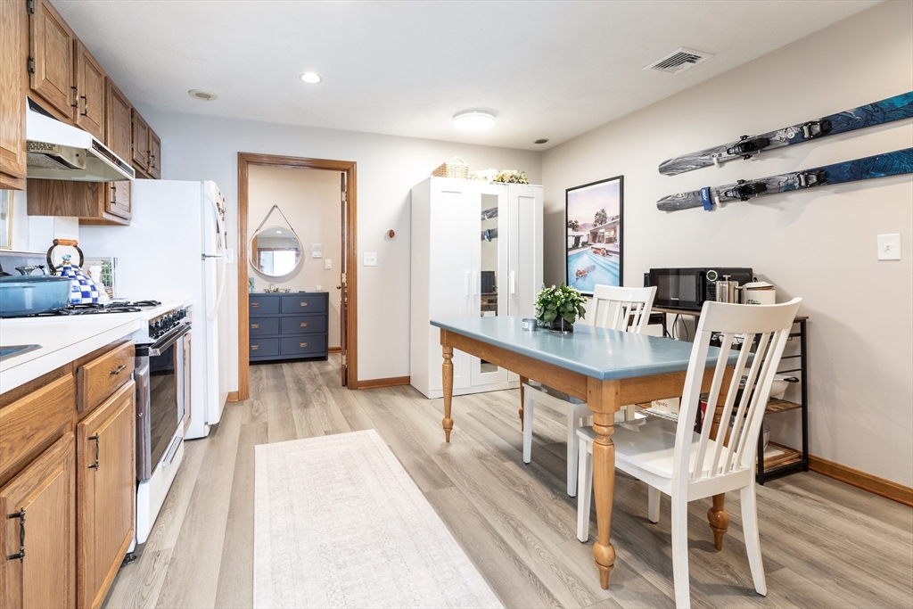 265 North Street, Unit A Boston, MA 02113 - Photo 7 of 17 a view of a kitchen with furniture and wooden floor