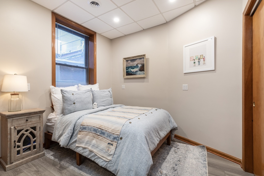 265 North Street, Unit A Boston, MA 02113 - Photo 10 of 17 a bedroom with bed and a window