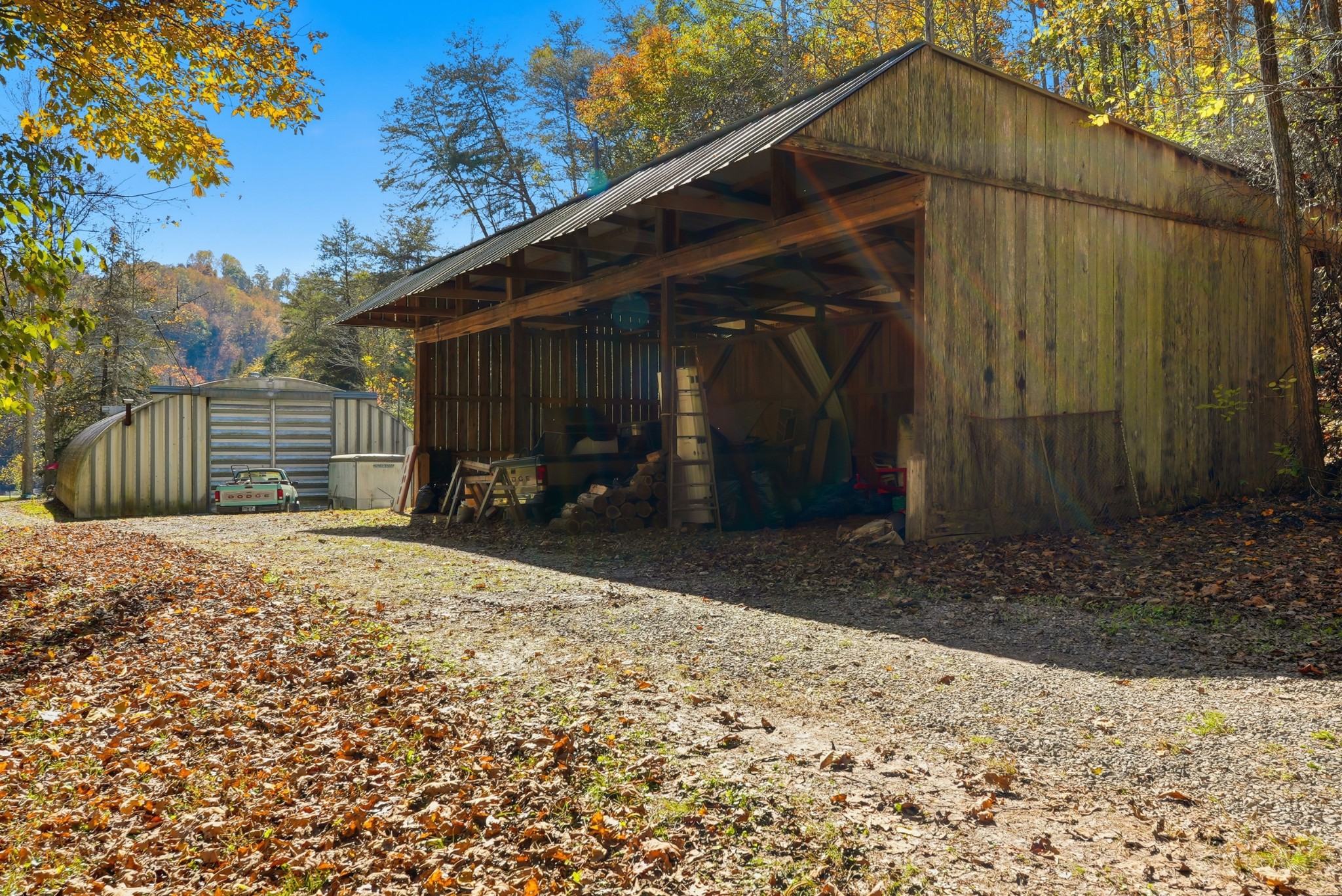 4300 Bull Run Road Ashland City, TN 37015 - Photo 52 of 61 a backyard of a house with barbeque oven and outdoor seating