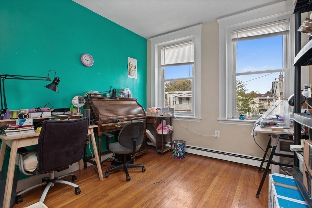 32 Ransom Road, Unit 10 Boston, MA 02135 - Photo 4 of 12 a view of a workspace with furniture and a window