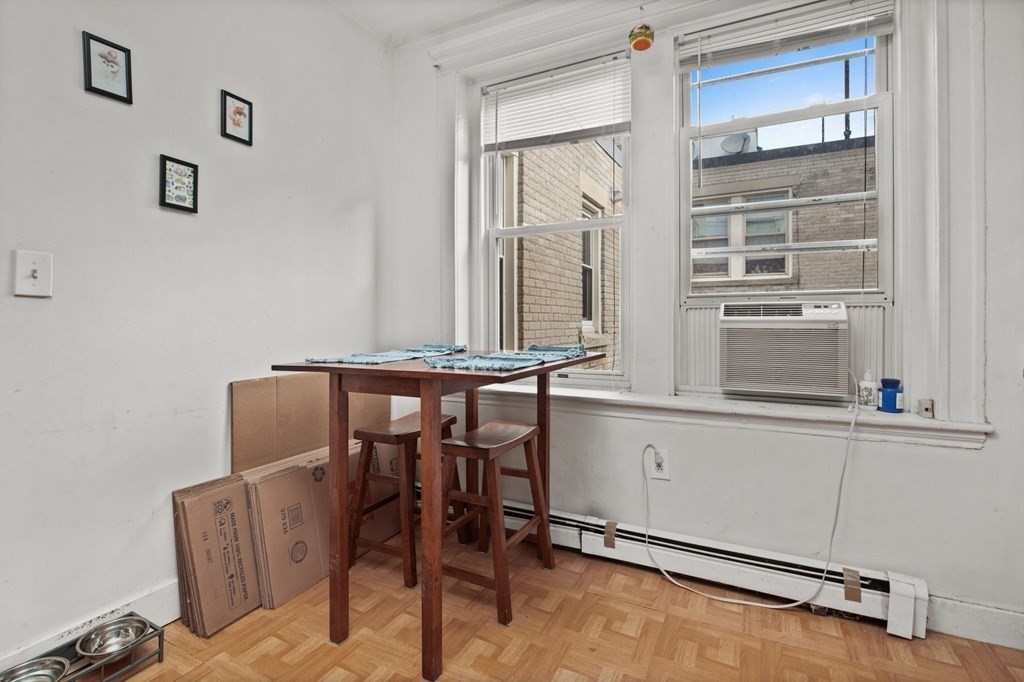 32 Ransom Road, Unit 10 Boston, MA 02135 - Photo 7 of 12 a dining room with furniture and window