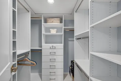 a bathroom with a shower a toilet and a sink