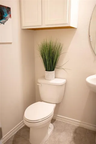 a bathroom with a toilet and a sink