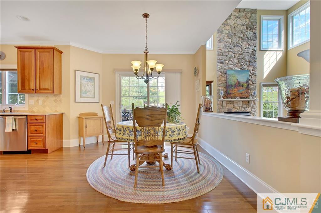 21 Rolin's Mill Road Flemington, NJ 08822 - Photo 11 of 25 a dining room with furniture a chandelier and wooden floor