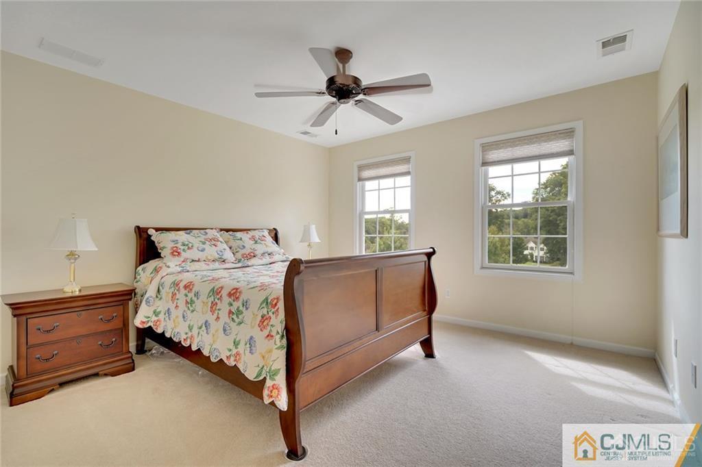21 Rolin's Mill Road Flemington, NJ 08822 - Photo 17 of 25 a spacious bedroom with a bed and window
