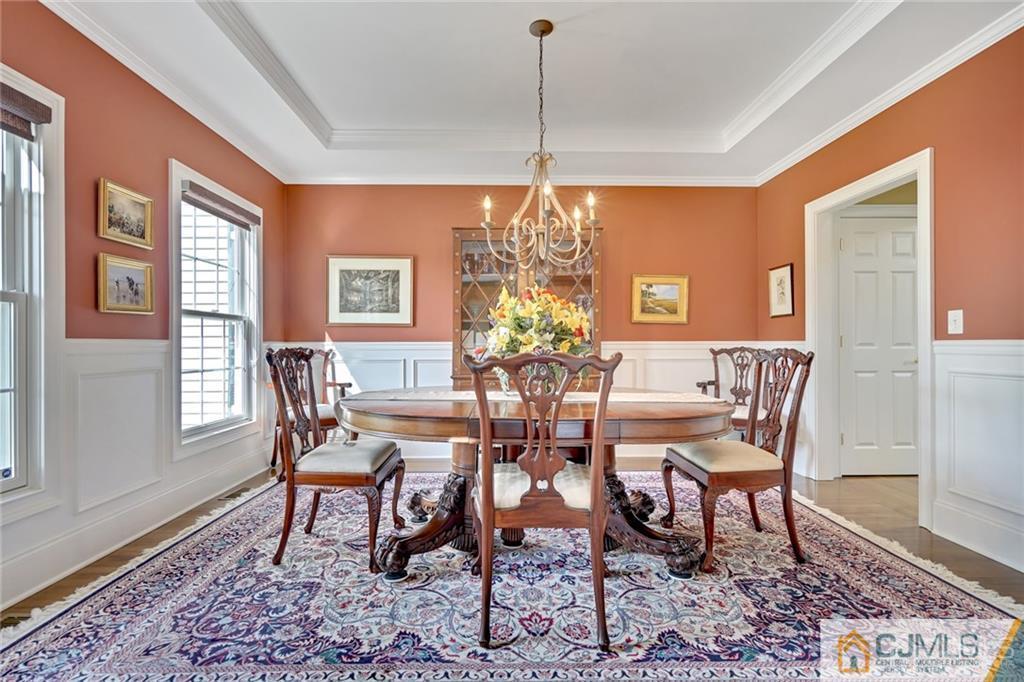 21 Rolin's Mill Road Flemington, NJ 08822 - Photo 3 of 25 a dining room with furniture a rug and a chandelier