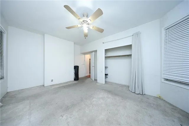 an empty room with closet area