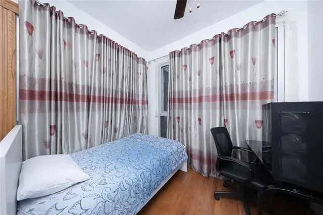 a bedroom with a bed and a chair