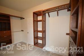 1409 Riverside Drive Charlotte, NC 28214 - Photo 16 of 23 a view of walk in closet with clothes and shoes