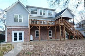 1409 Riverside Drive Charlotte, NC 28214 - Photo 4 of 23 a front view of a house with glass windows
