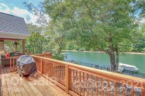 1409 Riverside Drive Charlotte, NC 28214 - Photo 5 of 23 a view of a two chairs in the balcony next to a yard