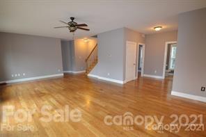 1409 Riverside Drive Charlotte, NC 28214 - Photo 7 of 23 a view of a big room with windows and chandelier fan