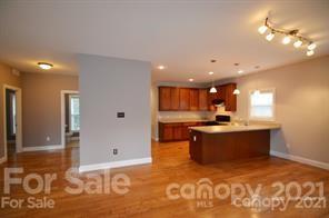 1409 Riverside Drive Charlotte, NC 28214 - Photo 9 of 23 a large kitchen with stainless steel appliances granite countertop a sink and a stove
