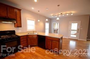 1409 Riverside Drive Charlotte, NC 28214 - Photo 10 of 23 a kitchen with a sink cabinets and window