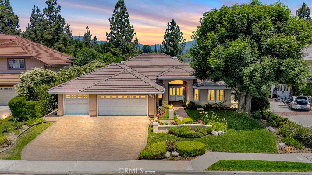 18845 Beechtree Lane Porter Ranch, CA 91326 - Photo 1 of 41 a front view of a house with garden