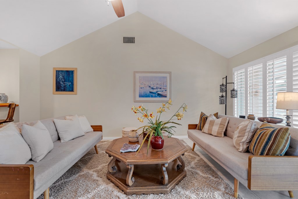 18845 Beechtree Lane Porter Ranch, CA 91326 - Photo 16 of 41 a living room with furniture a rug and a window
