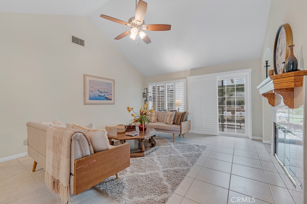 18845 Beechtree Lane Porter Ranch, CA 91326 - Photo 17 of 41 a living room with furniture a chandelier and a window