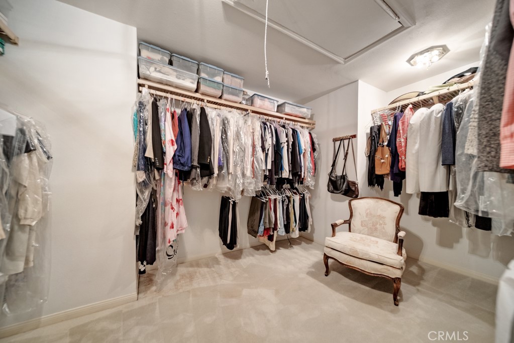18845 Beechtree Lane Porter Ranch, CA 91326 - Photo 21 of 41 a view of walk in closet with clothes and shoes