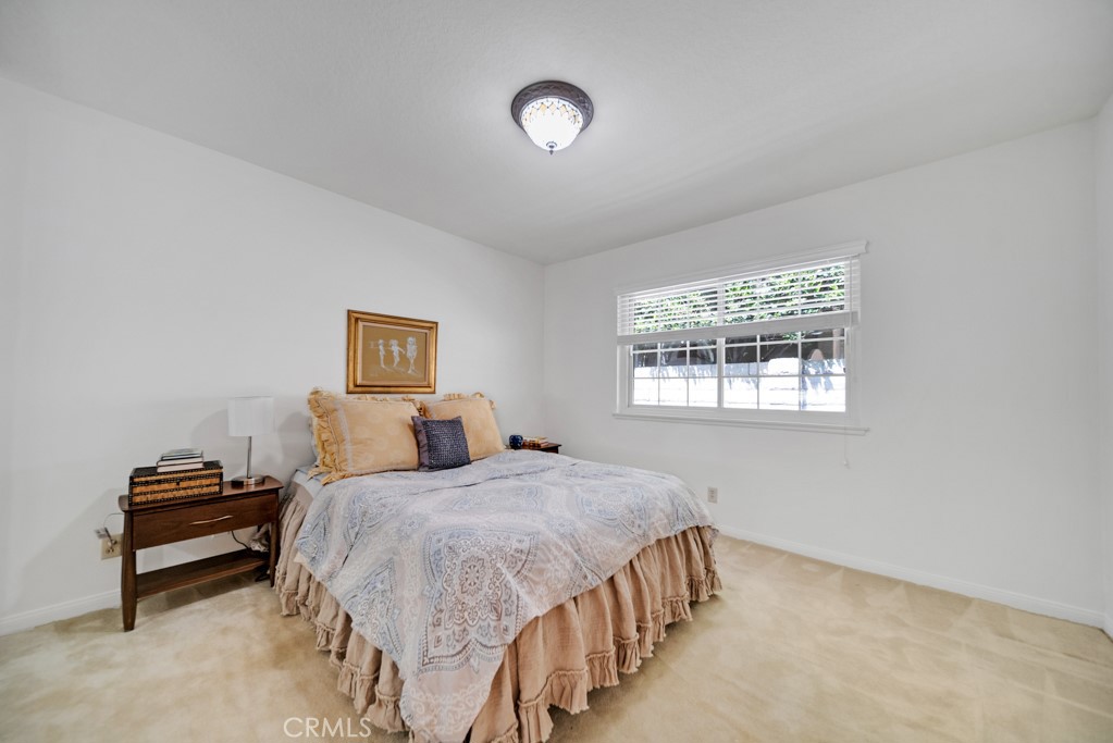 18845 Beechtree Lane Porter Ranch, CA 91326 - Photo 26 of 41 a bedroom with a bed and a window