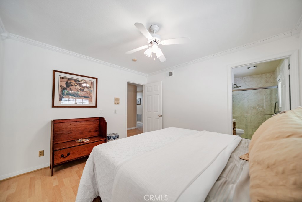 18845 Beechtree Lane Porter Ranch, CA 91326 - Photo 28 of 41 a bedroom with a bed and dresser